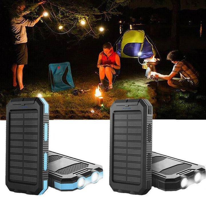 Hand holding the compact portable waterproof solar charger power bank for travel.