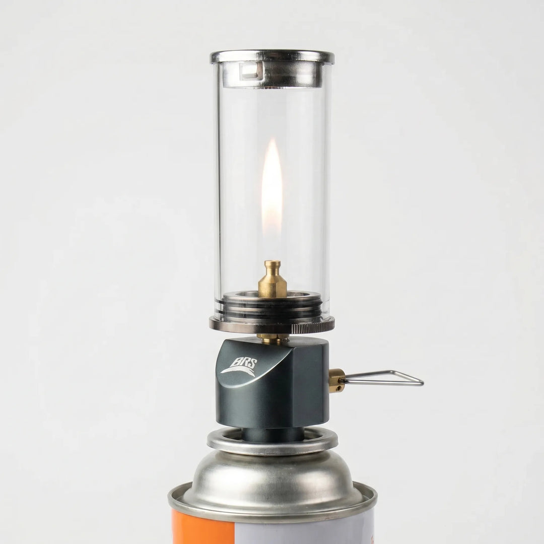 Portable windproof gas candle lantern for camping & hiking adventures. Ideal outdoor tent light.