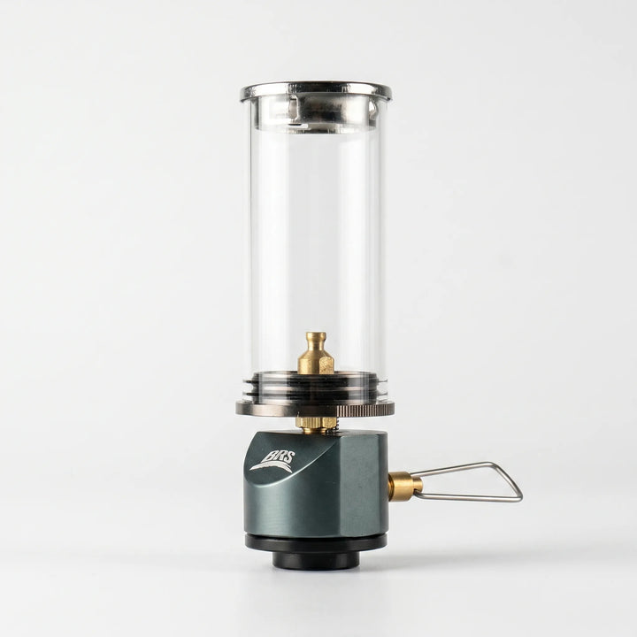 Compact windproof gas candle lamp for outdoor camping, hiking & tent use. Creates warm atmospheric light.