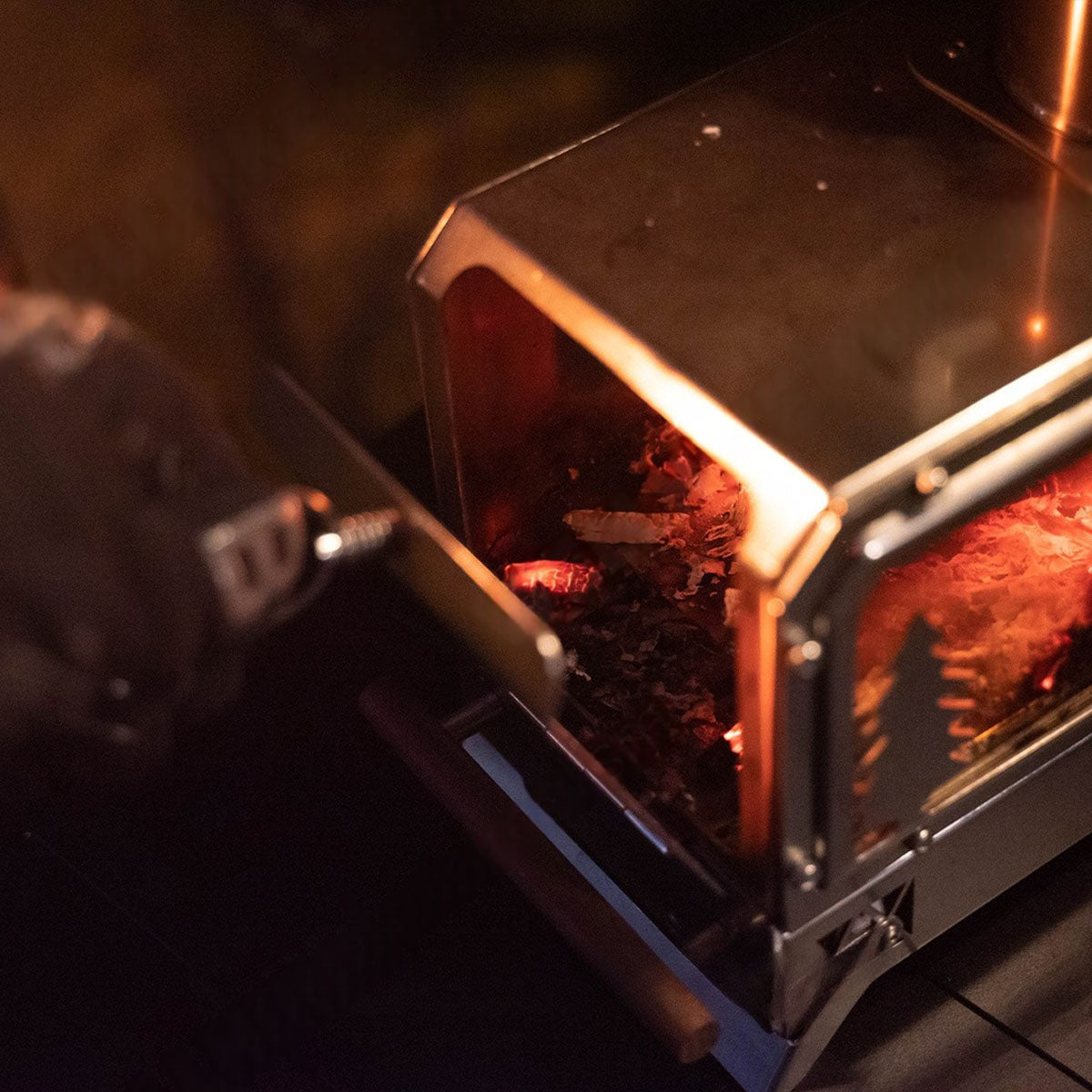 Compact wood burning stove, ideal for winter camping, hiking, and outdoor adventures