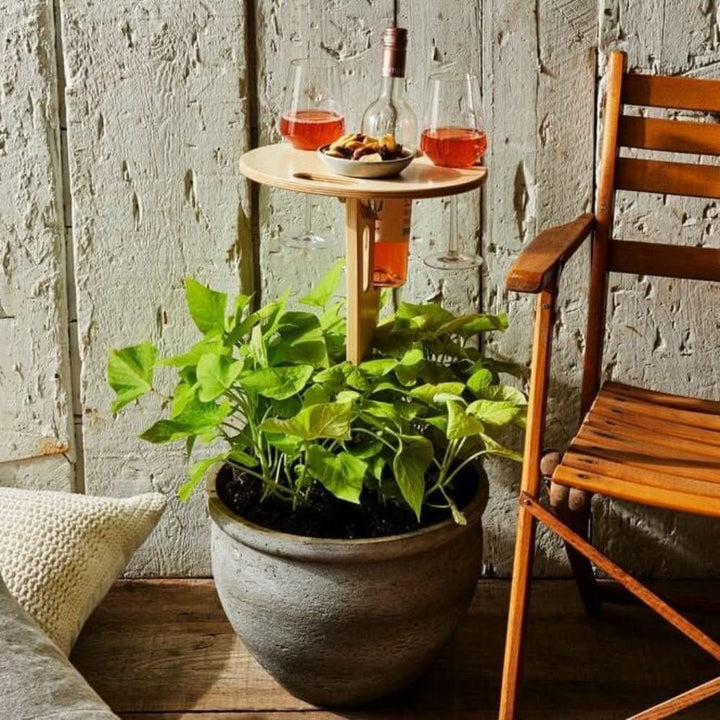 Compact outdoor wine table with built-in glass holders & snack tray. Perfect for picnics, beach, and garden entertainment.