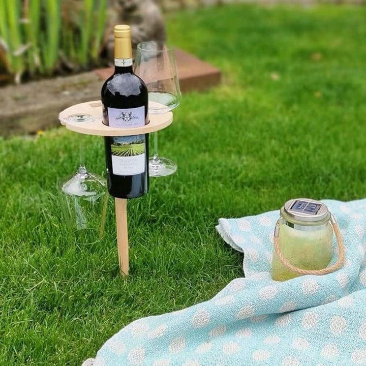 Gift for wine lovers: Portable picnic wine table with stemware slots & snack holder for outdoor entertaining.