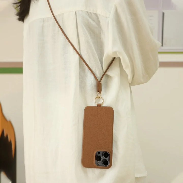 Unisex green leather crossbody smartphone cover. Elegant and practical phone strap for hands-free convenience.