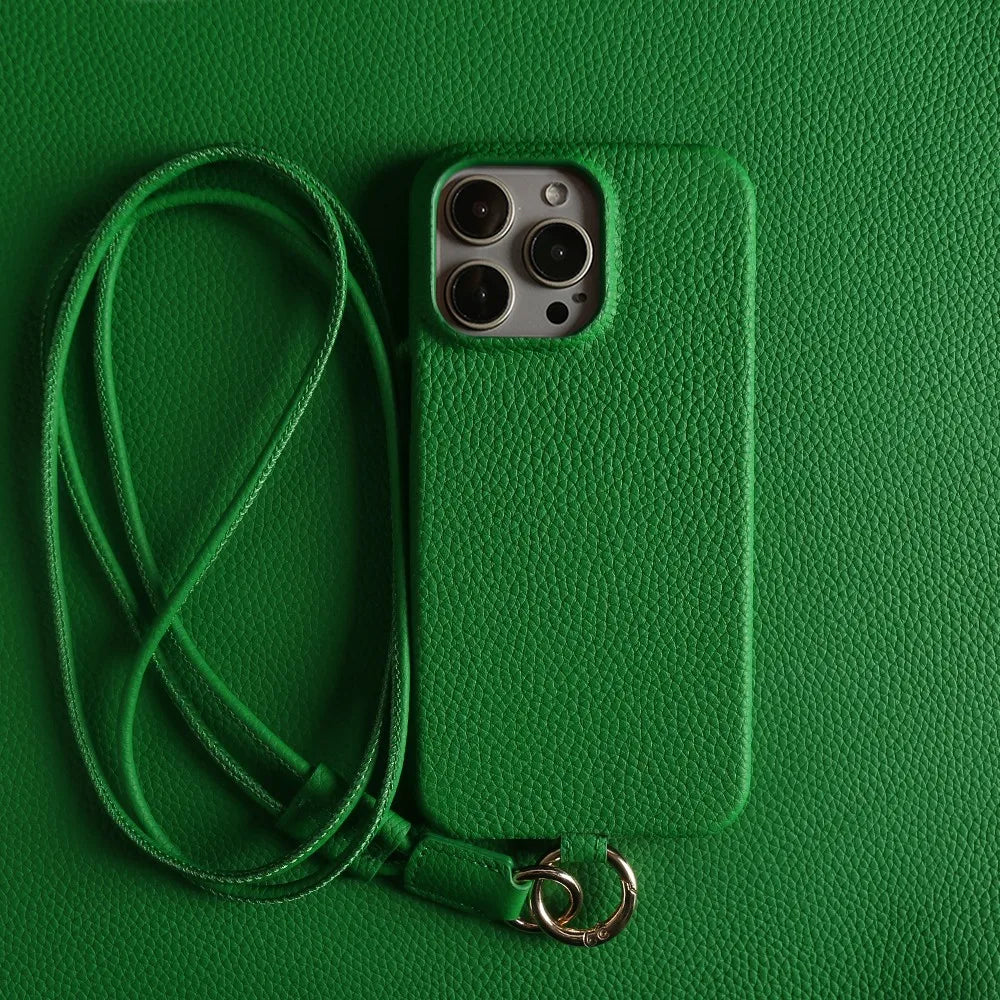 Stylish orange leather crossbody smartphone case, iPhone compatible. Genuine leather for hands-free elegance.