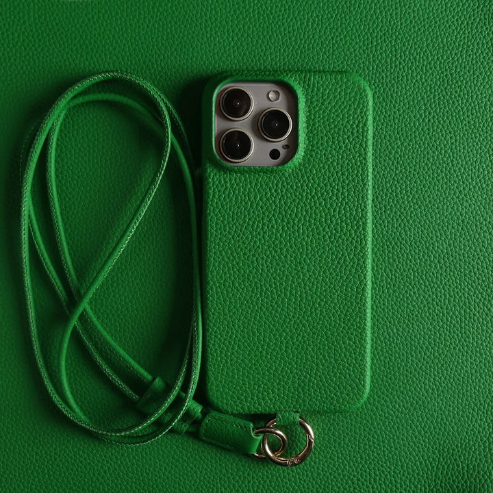 Stylish orange leather crossbody smartphone case, iPhone compatible. Genuine leather for hands-free elegance.
