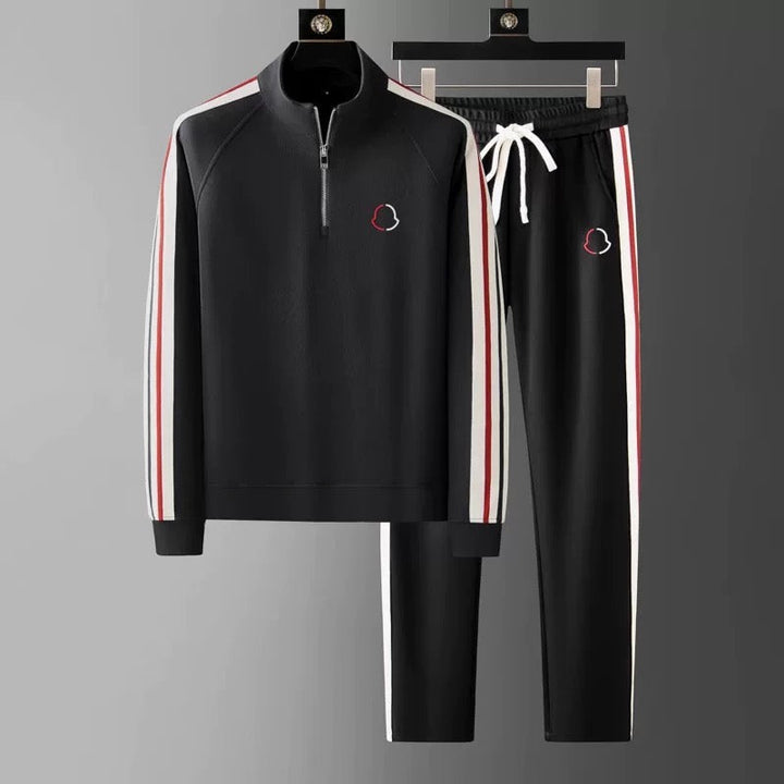 Close-up of the quarter-zip detail on a men's premium tracksuit top, showing quality.