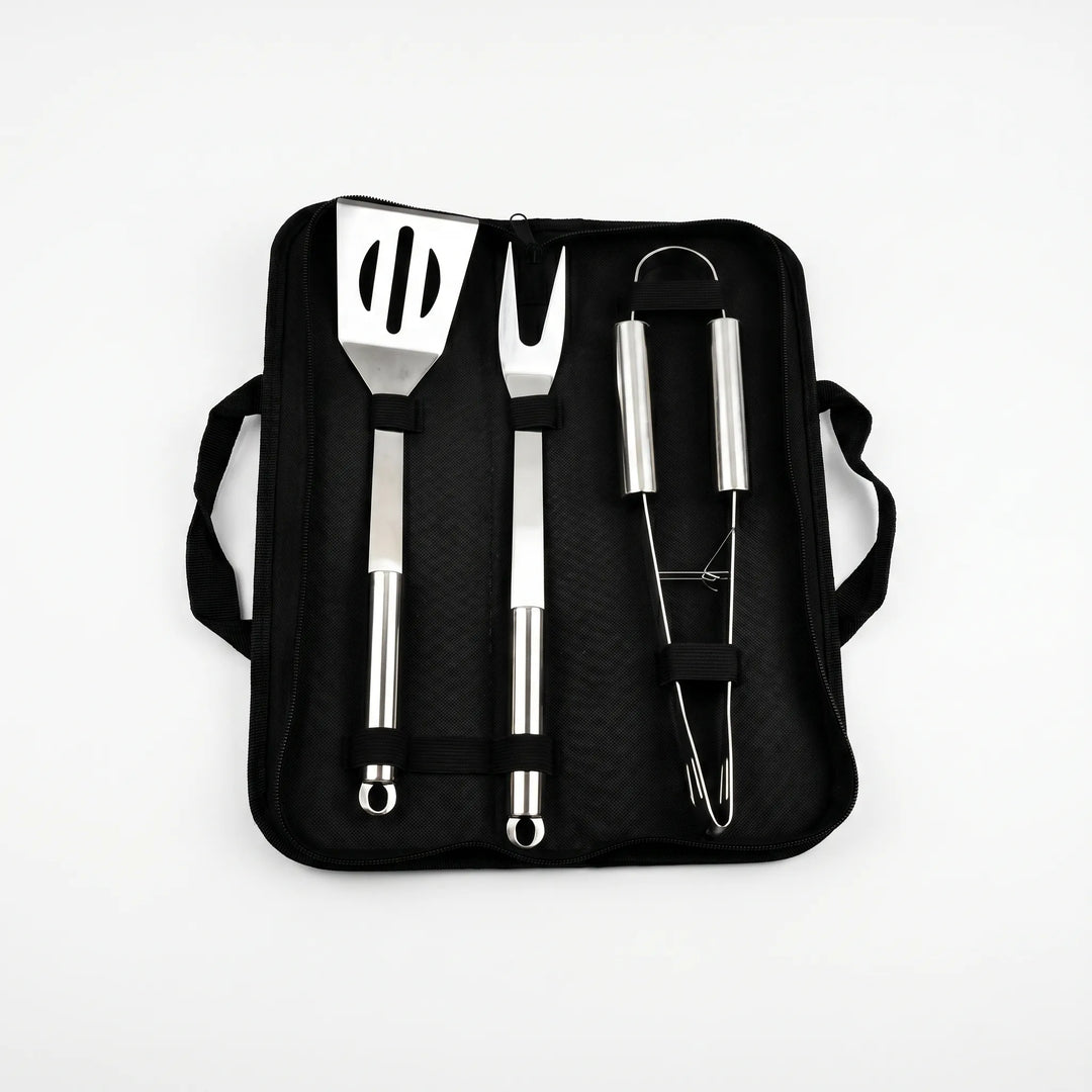 Essential stainless steel grill accessories in a portable bag, a complete BBQ tool set for easy outdoor entertaining.