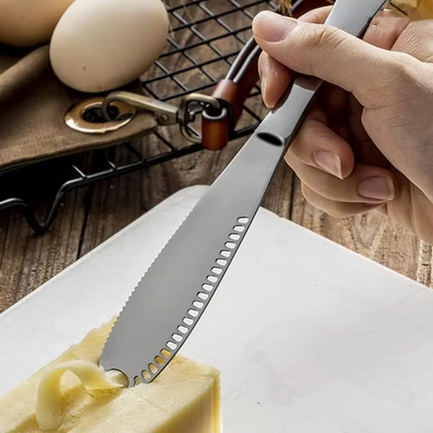 Kitchen essential: adjustable stainless steel cheese slicer for cutting hard & soft cheeses precisely.