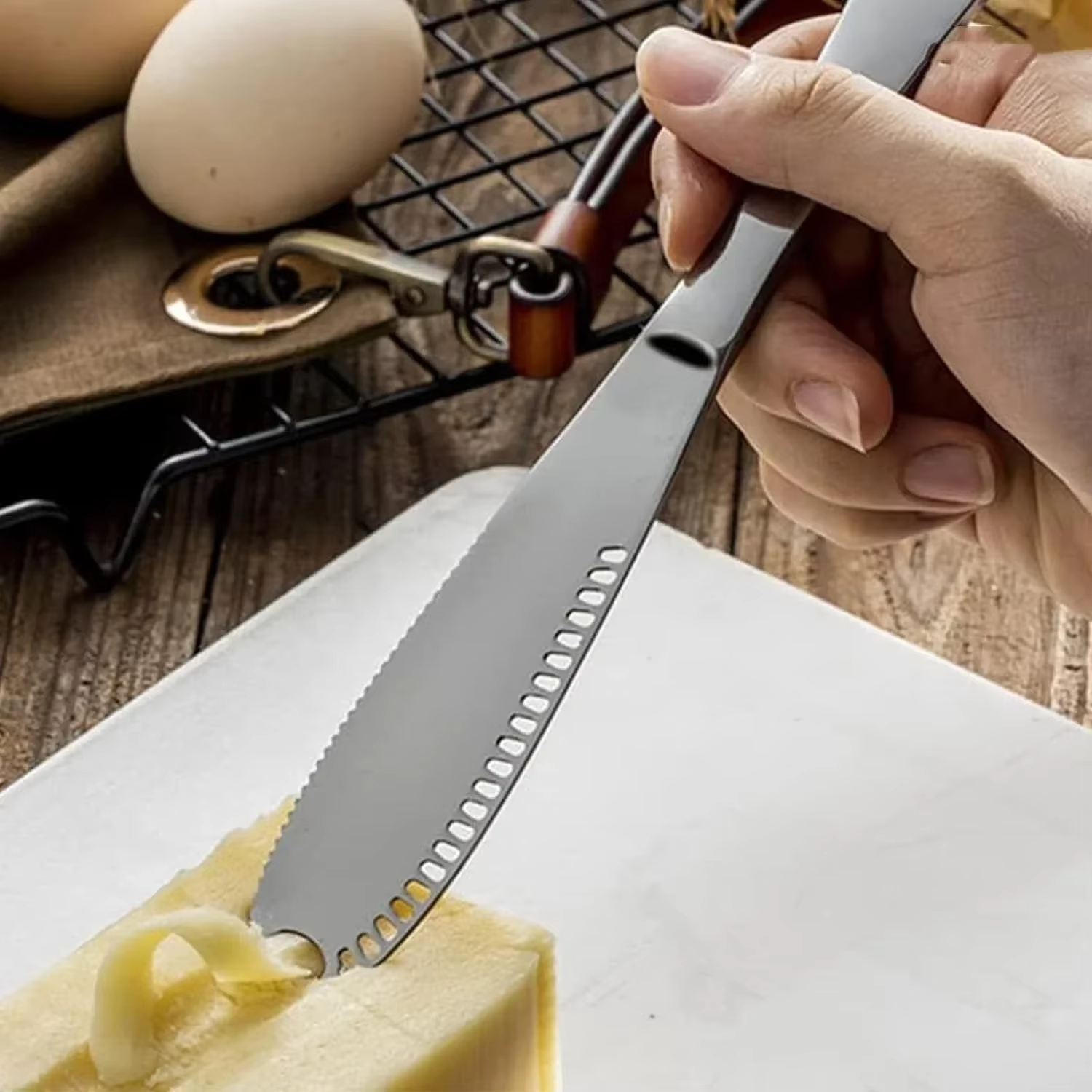 Kitchen essential: adjustable stainless steel cheese slicer for cutting hard & soft cheeses precisely.