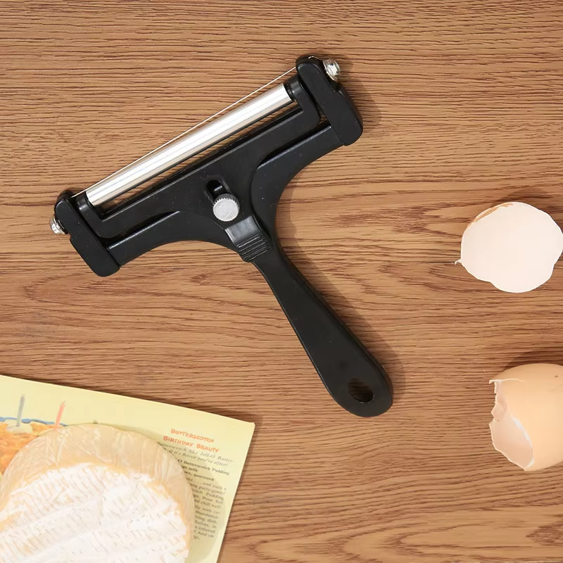 High-quality stainless steel cheese slicer, an adjustable kitchen tool for perfect cheese portions.