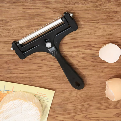 High-quality stainless steel cheese slicer, an adjustable kitchen tool for perfect cheese portions.