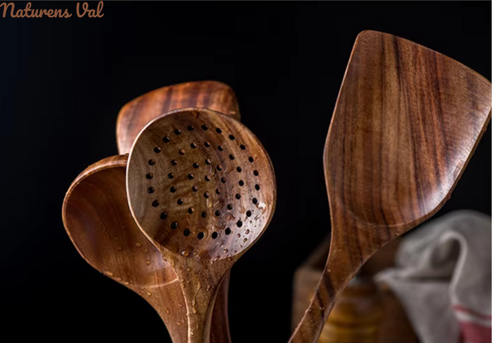 Teak wood cooking utensil stirring a pot, natural & safe for non-stick cookware.