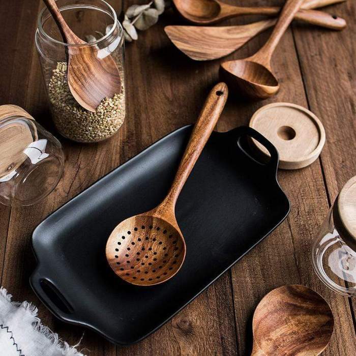 Close-up of smooth teak wood texture on a kitchen utensil, eco-friendly & durable.