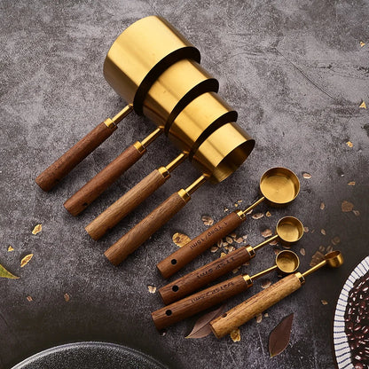 Durable stainless steel measuring spoons with wood handles for accurate baking and cooking.