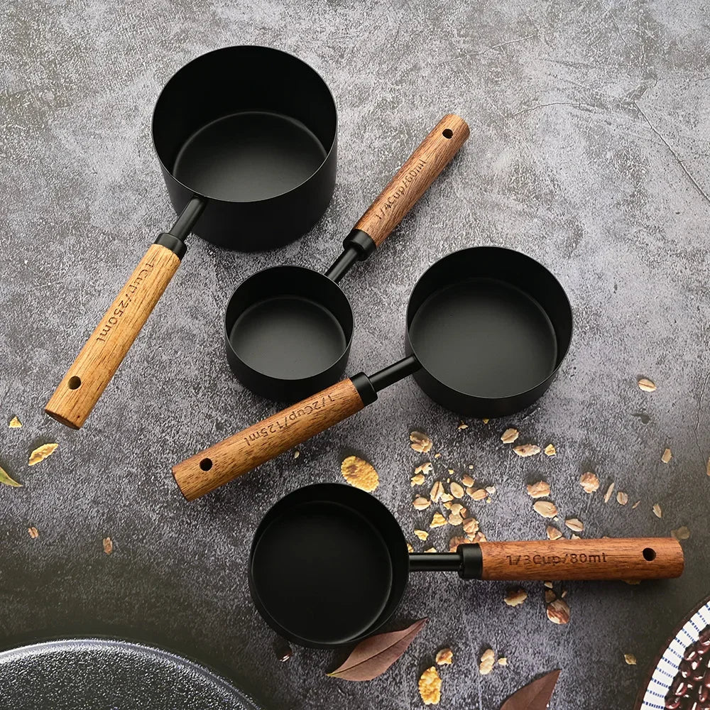 Chef-quality stainless steel measuring spoons with wood handles for precise home kitchen measurements.
