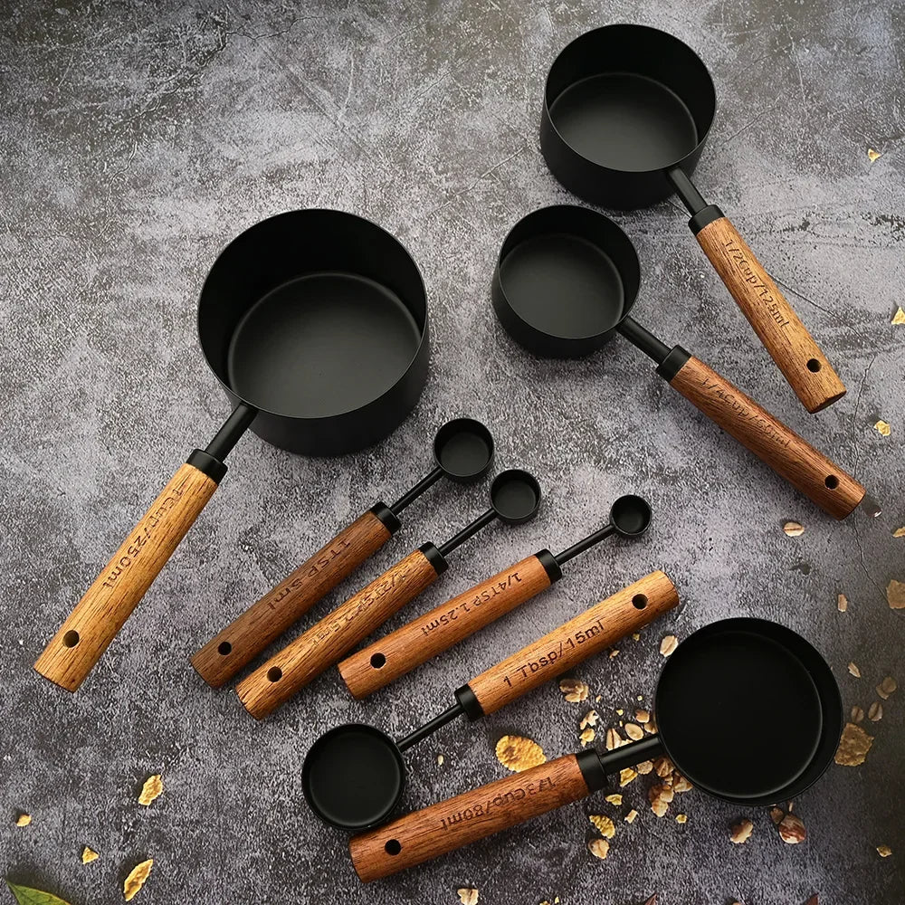Essential baking & cooking accessory: stainless steel measuring spoon set with natural wood handles.