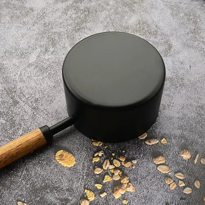 Premium cooking utensil set: stainless steel measuring spoons with ergonomic wooden handles.
