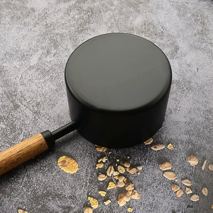Premium cooking utensil set: stainless steel measuring spoons with ergonomic wooden handles.