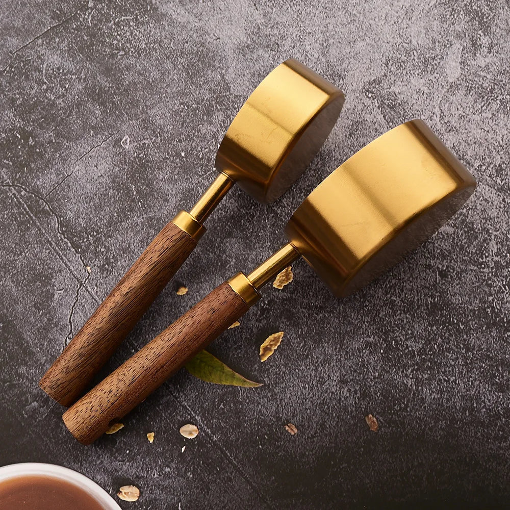 Professional stainless steel measuring spoon set, wooden handles, built for durability and chef tasks.