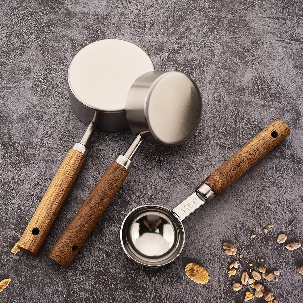 Home kitchen essential: stainless steel measuring spoon set with beautiful wooden handles.