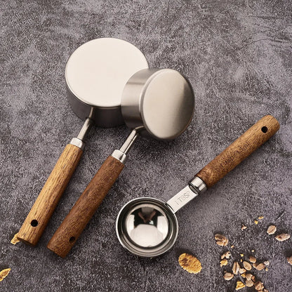 Home kitchen essential: stainless steel measuring spoon set with beautiful wooden handles.