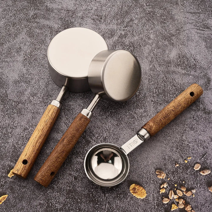 Home kitchen essential: stainless steel measuring spoon set with beautiful wooden handles.