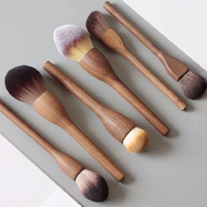 Professional vegan makeup brush set with elegant walnut handles, cruelty-free cosmetic tools for flawless application.