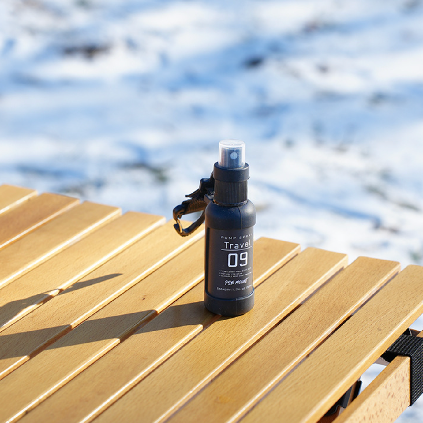 Stack of QuickMist utility spray bottles, highlighting the compact and portable design for camping