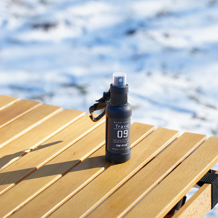 Stack of QuickMist utility spray bottles, highlighting the compact and portable design for camping