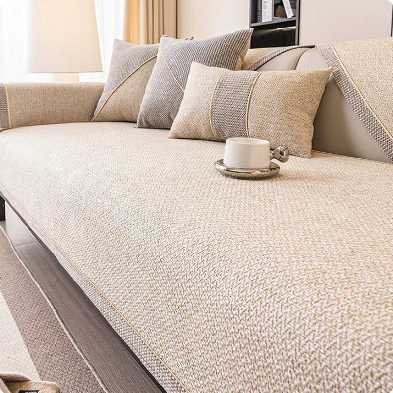 Pet-friendly non-slip sofa protector. Quilted cotton-linen keeps furniture clean from paws & spills.