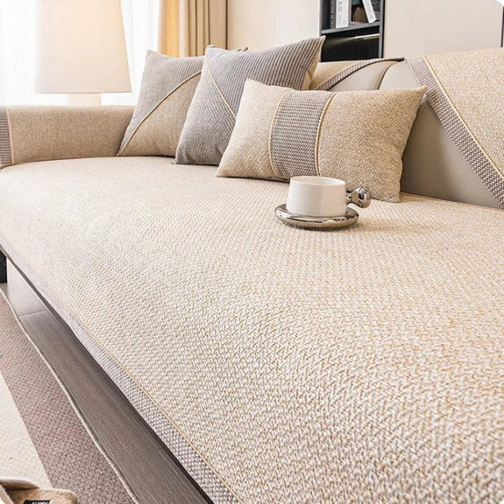 Pet-friendly non-slip sofa protector. Quilted cotton-linen keeps furniture clean from paws & spills.
