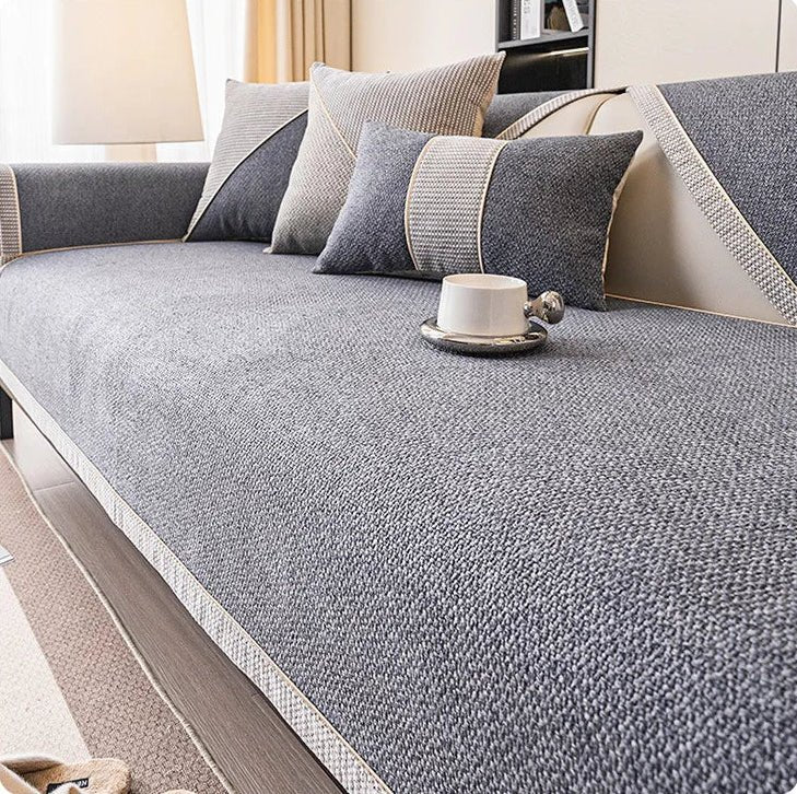 Close-up of quilted cotton-linen sofa protector fabric, showing texture, stitching, & quality weave.
