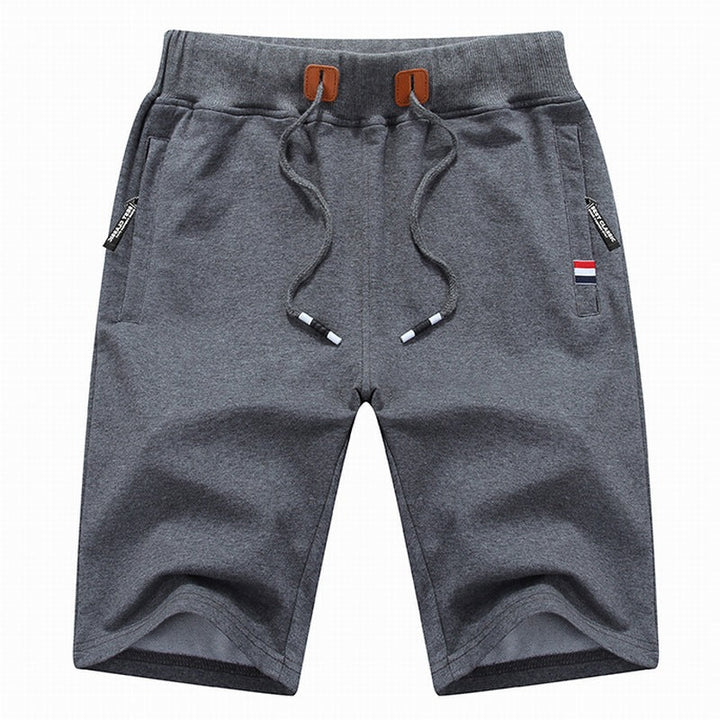 Active man wearing Randy casual drawstring shorts, great for summer fashion & relaxed daily wear.