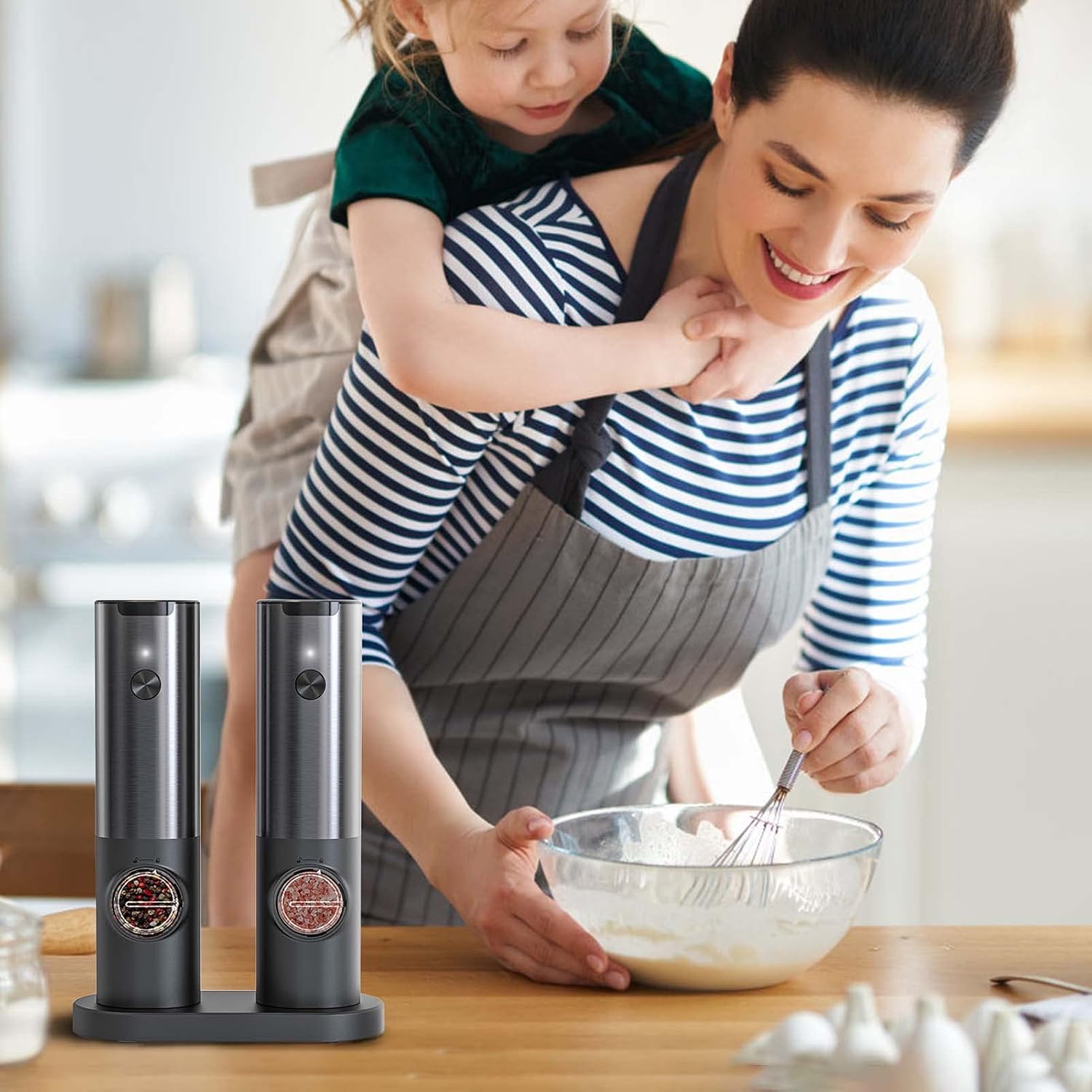 Sleek stainless steel rechargeable electric salt & pepper grinder set. Easy one-hand operation for kitchen tasks.
