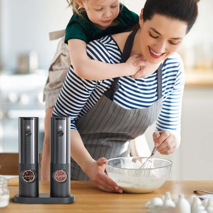 Sleek stainless steel rechargeable electric salt & pepper grinder set. Easy one-hand operation for kitchen tasks.