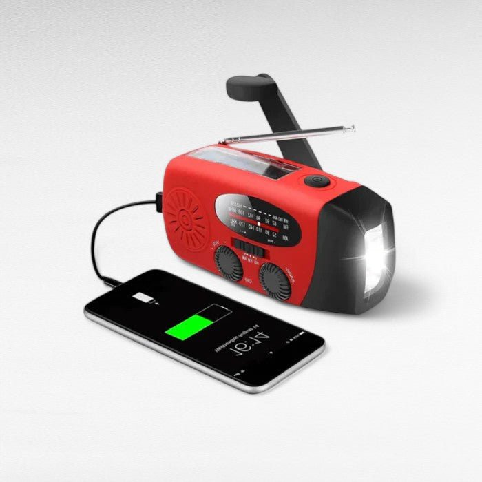 Durable red emergency radio with hand crank, solar charging, flashlight, and power bank for disasters