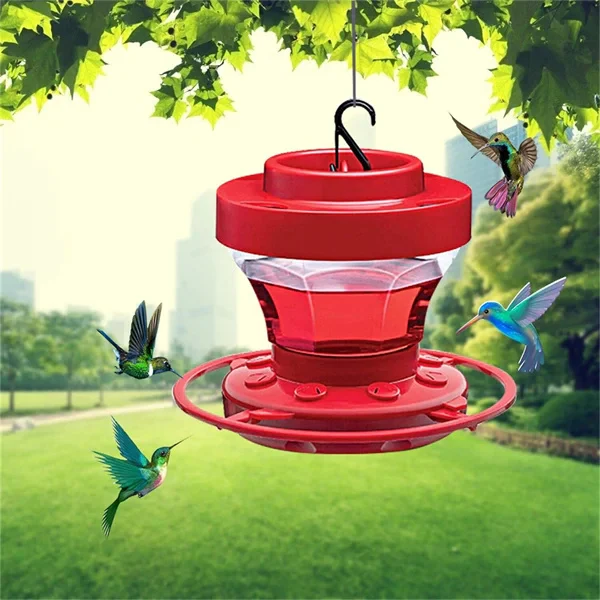 Red outdoor hanging hummingbird feeder with bee-proof design & perch. Ideal for garden bird watching & nectar feeding.