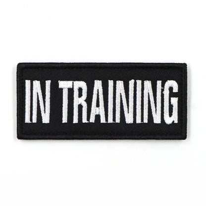 Stack of multiple 'SERVICE DOG' patches, ready for bulk purchase as K9 accessories or training aids