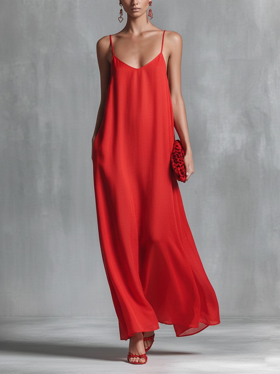 Red V-neck spaghetti strap flowy maxi dress for women. Elegant summer evening wear & resort vacation outfit.
