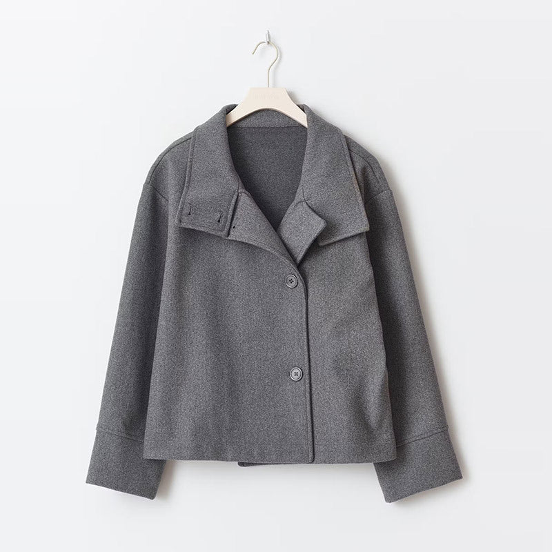 Women's short coat featuring a high neck, full button closure, and a comfortable relaxed fit for everyday style.
