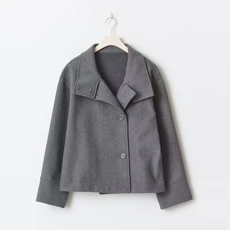Women's relaxed fit short coat with high neck and button closure, styled for a cozy, casual fall and winter look.