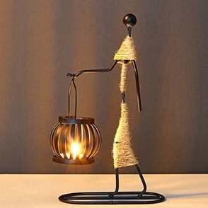 Vintage-inspired retro metal candle holder, bringing stylish charm and warmth to home decor.