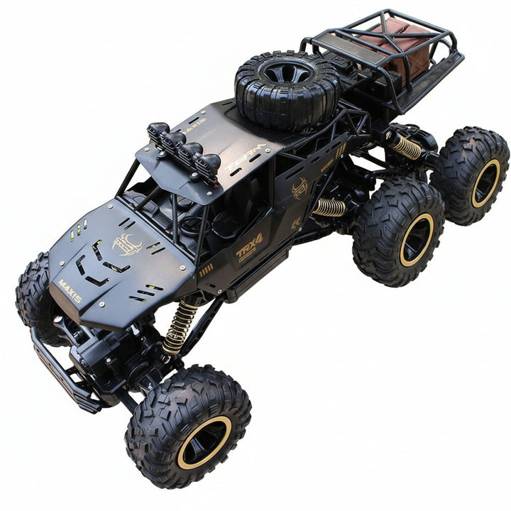 Powerful ROCKSTRIKER 6x6 all-terrain RC truck conquering off-road obstacles, perfect for outdoor adventure.