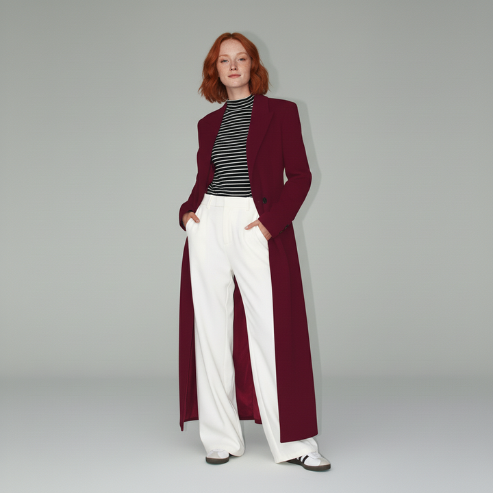 Minimalist ruby long fitted coat for women, an elegant tailored outerwear piece. City style.
