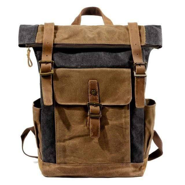Rugged canvas leather hiking backpack next to a campfire.