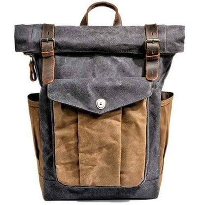 Close-up of the front pocket on a rugged men's canvas backpack.