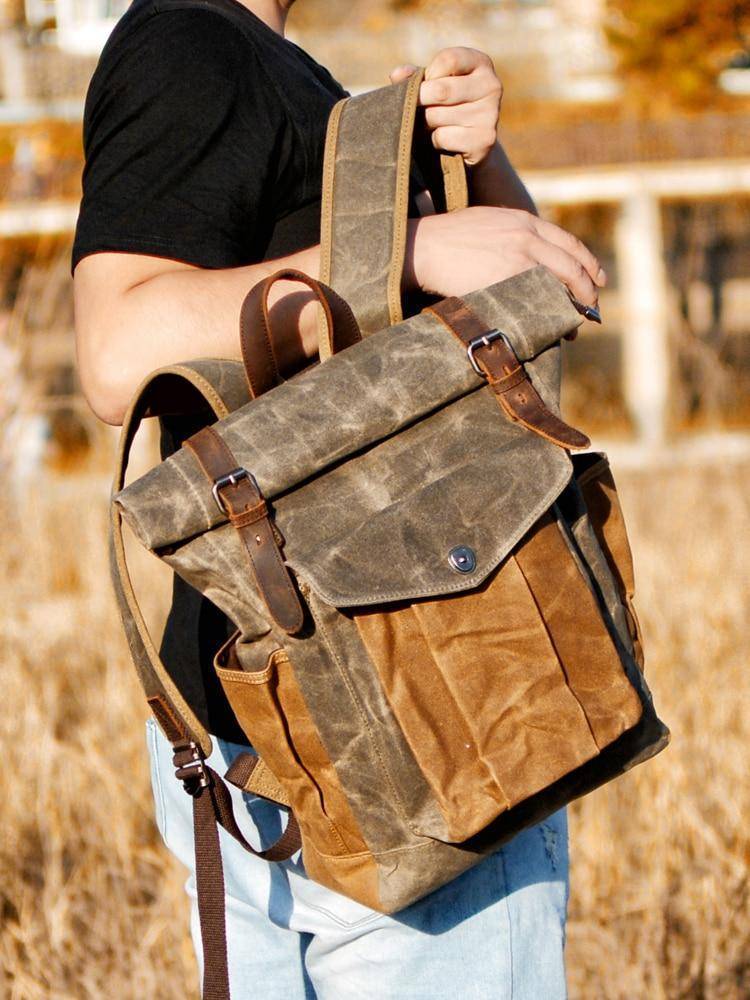 Men's outdoor hiking backpack with durable canvas and leather trim.