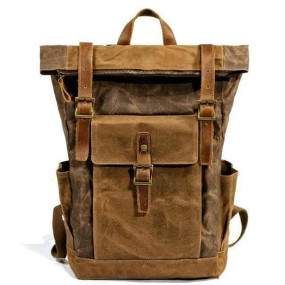 Open rugged canvas and leather backpack, showing spacious interior.