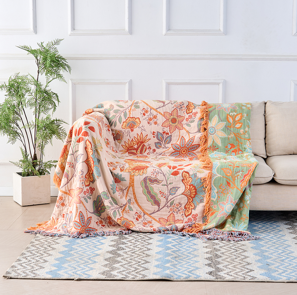 Rustic floral boho cotton blanket, a cozy and decorative throw for bohemian home decor.