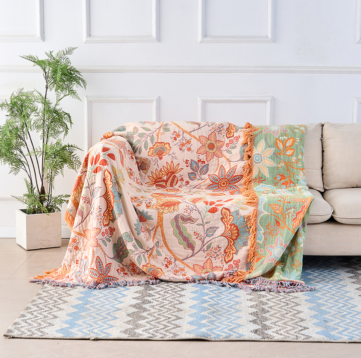 Rustic floral boho cotton blanket, a cozy and decorative throw for bohemian home decor.